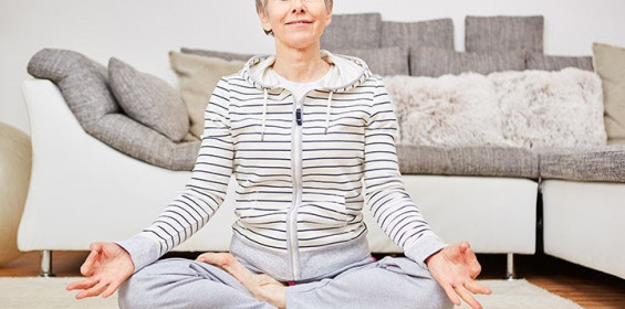 woman meditating indoors